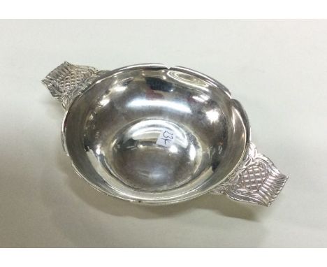 A silver wine taster. London 1937. By R E Stone. Approx. 89 grams. Est. £200 - £300.
