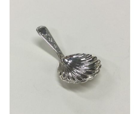 EXETER: An engraved silver caddy spoon. Circa 1810. By WW. Approx. 9 grams. Est. £30 - £50.