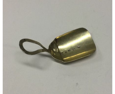 A silver gilt caddy spoon with loop handle. Birmingham 1804. By Samuel Pemberton. Approx. 9 grams. Est. £20 - £30.