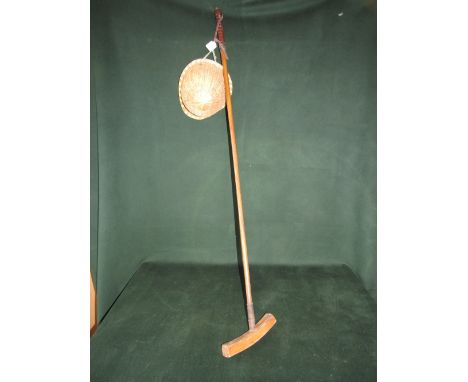 Early polo stick with unusual cane helmet