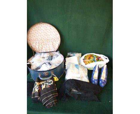 2 Edwardian blue suitcases containing, a varied selection of textiles, lace & linen. 2 decorative skirts. Pair of blue high h