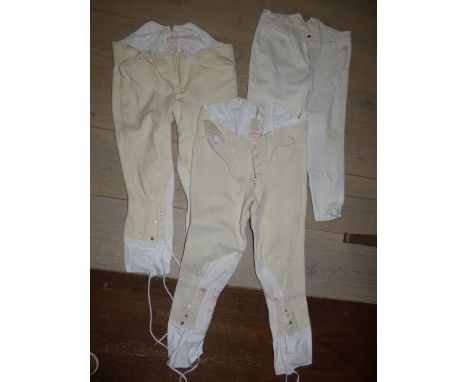 Two pairs of cream cord hunting breeches by Bernard Weatherill of Saville Row, & one pair of well used white hunting breeches