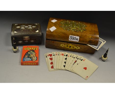 A Victorian brass mounted domed topped games box, inc linen backed playing cards, pen trump markers etc;  an inlaid casket (2