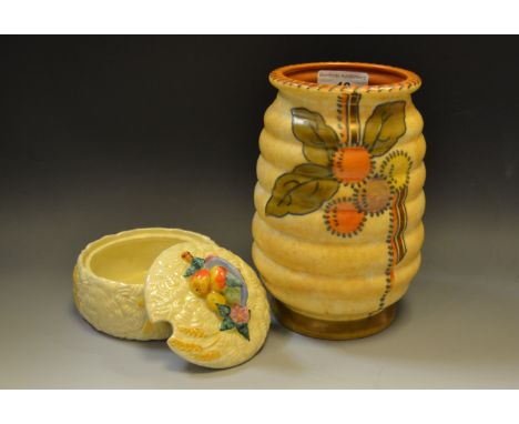 A Clarice Cliff Celtic Harvest preserve pot; a Charlotte Rhead ribbed ovoid vase (2)