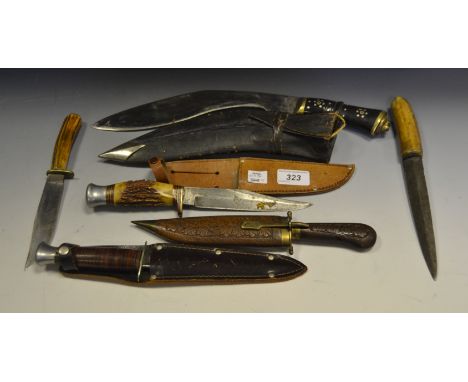 An early 20th century Kukri knife and scabbard;   a William Rogers knife, in scabbard;  a huning knife 'Sabre', horn haft;  o