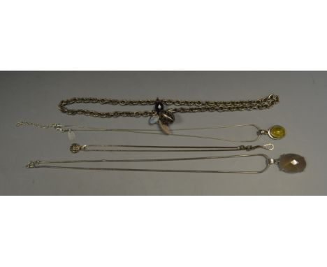 A silver-set clouded amethyst on a silver chain; a silver necklace, pierced heart pendant, 37.6 g; other silver chains (4)