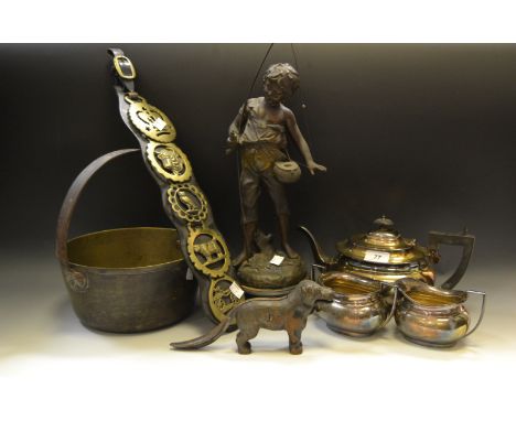 A spelter figure of a Fisher Boy; a cast nutcracker in the form of a dog; brass jam pan; three piece silver plated tea servic