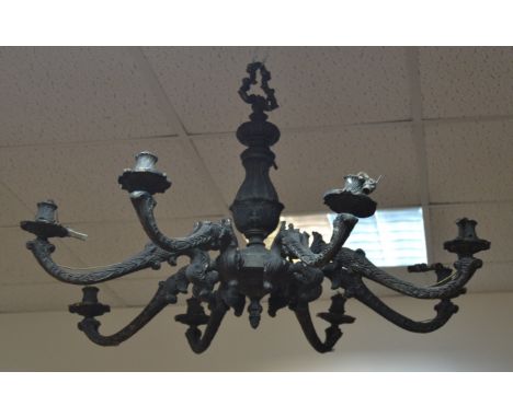 A late Victorian cast iron, eight arm chandelier 