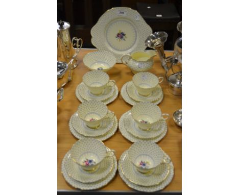 A Paragon 'Fleur de Lis' pattern tea service for six, including tea cups and saucers, side plates, cream jug, sandwich plate,