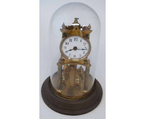 Brass perpetual movement clock under glass dome. Condition report: see terms and conditions.