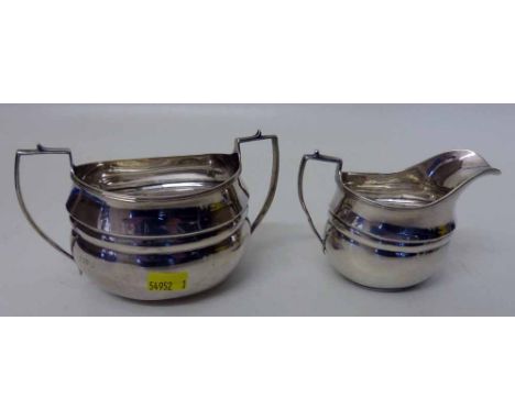 Chester silver Georgian style milk jug and sugar basin by Nathan and Hayes. Condition report: see terms and conditions.