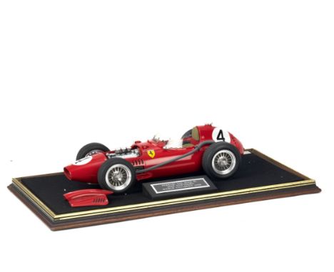 An MG Models limited edition scale model of Mike Hawthorn's 1958 Driver World Championship Ferrari 246 Dino F1, by Midland Ra