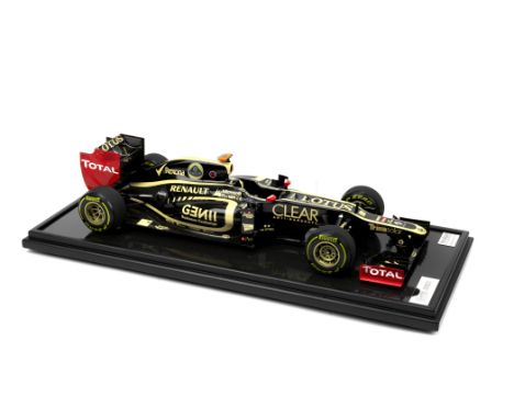 A 1:8 scale limited edition model of a 2012 Season Lotus F1 Team E20, by Amalgam,limited edition number 04/99, resin body wit