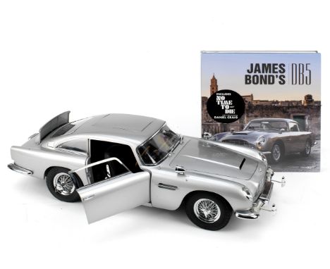 A finely detailed 1:8 scale model of the James Bond 'Goldfinger' Aston Martin DB5 by Eaglemoss,kit-built from the Eaglemoss s