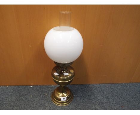 A good quality brass oil lamp with white spherical glass shade, approximate height 50 cm. Estimate £20 - £40