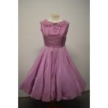 A mauve lightweight taffeta day dress, having portrait collar with cutwork and machine embroidery,