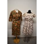 A 1960s autumnal print Trevira dress and a 1950s abstract roe patterned cotton day dress.