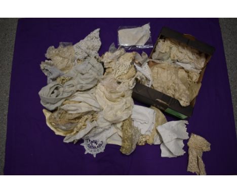 A box full of lace, crochet and similar, including modesty panel, doyleys, edgings etc.