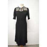 A 1940s black crepe de chine day dress, having tulle layer to bodice with bands to create a cage