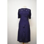 A 1940s floppy navy blue rayon or similar day dress, having soutache style braiding to bodice and