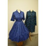 A 1950s full skirted cotton day dress, having brilliant novelty medallion print on cobalt blue