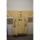 A 1930s cream kimono dressing gown, having Dragon embroidered to centre of reverse and pockets.