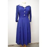 A Royal blue 1940s day dress, having buttons to front, side metal zip and white pique collar.