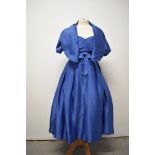 An electric blue satin 1950s strapless evening gown with matching jacket, having boned bodice,