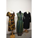 Three vintage 1950s nd 1960s dresses, including abstract floral cotton dress in autumnal tones and