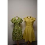 A late 1940s multi coloured floral day dress, having V neckline and gathered skirt and bust, sold