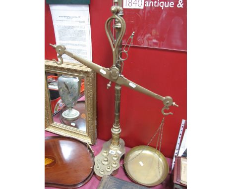 A Set of Brass Balance Scales, with eight graduated weights inset to shaped base.