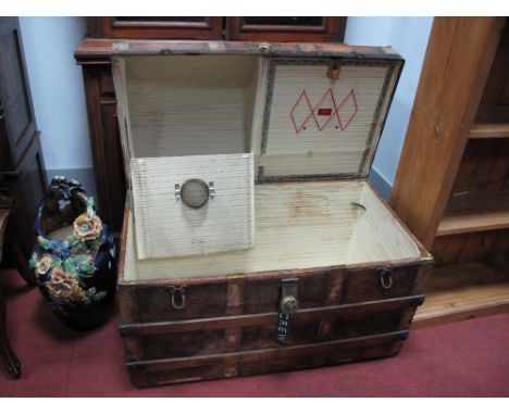 A XIX Century Dome Topped Travel Trunk, with metal mounts, wooden enforcers, twin hat compartments under lid, (no inner tray)