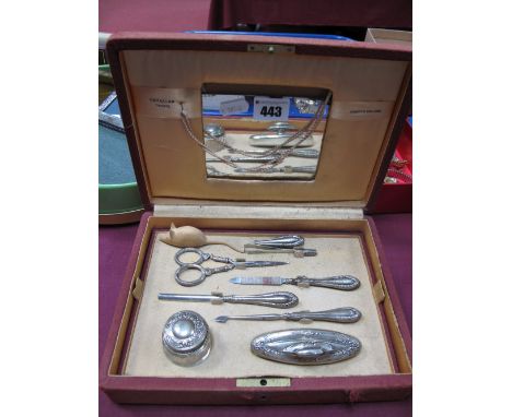 A XX Century Seven Piece Manicure Set, stamped "800" with damages, in fitted case with mirror, labelled 'Cavallar, Trieste, A