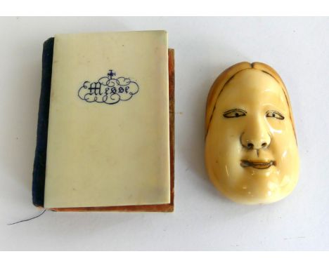 A Japanese Noh Mask netsuke, 19th Century  
Together with a further French ivory mounted miniature book entitled 'Paroissien 