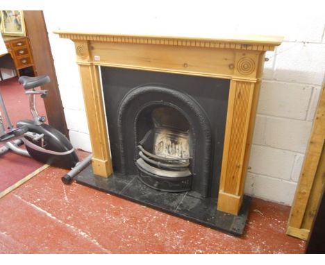 Fireplace with marble base, cast iron insert and pine surround
