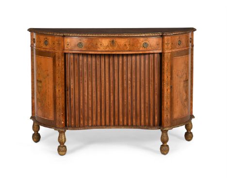 Y A SATINWOOD, NEOCLASSICAL MARQUETRY AND PARCEL GILT COMMODE OR SIDE CABINETIN GEORGE III STYLE, 19TH CENTURYThe serpentine 