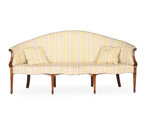 A GEORGE III MAHOGANY AND UPHOLSTERED SERPENTINE SHAPED SOFAIN THE MANNER OF GEORGE HEPPLEWHITE, CIRCA 177599cm high, 198cm w