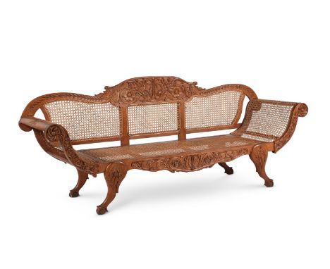 AN ANGLO-INDIAN SOLID PADOUK AND CANED SOFACEYLONESE, LATE 19TH CENTURY95.5cm high, 230cm wide, 69cm deepCondition Report: Ma