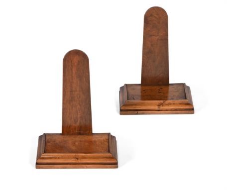 A PAIR OF VICTORIAN WALNUT PLATE OR SALVER STANDSIN THE MANNER OF HOLLAND & SONS, SECOND HALF 19TH CENTURY29cm high, 23cm wid