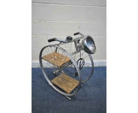 A BESPOKE VINTAGE BICYCLE WHEEL FLOOR LAMP, with two shelves, width 50cm x depth 65cm x height 77cm (condition report: missin