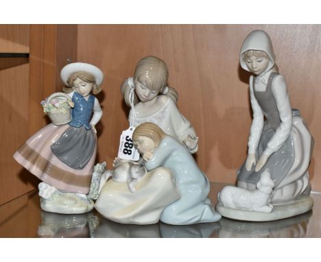 A GROUP OF THREE LLADRO AND NAO FIGURES, comprising 1534 'Little Sister',  5221 'Sweetest Scent' designed by José Puche, toge