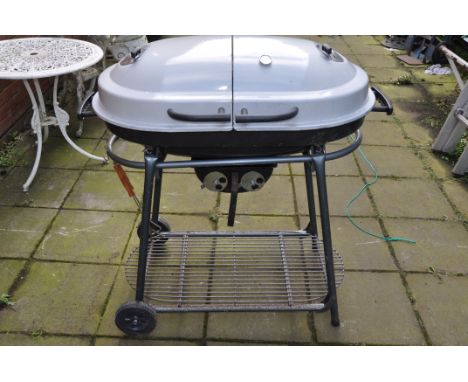 A MODERN COAL BARBECUE with dual enamel domed lids, temperature gauge, stand with undershelf width 100cm (Condition Report: s