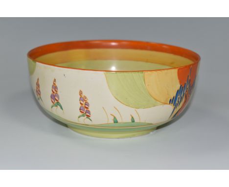 A CLARICE CLIFF 'WINDBELLS' DESIGN BOWL, with a vibrant orange, yellow, green and cream banding on the interior, printed mark