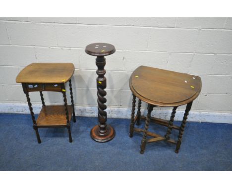 AN OAK BARLEY TWIST GATE LEG TABLE, along with an oak berley twist lamp table with a single drawer, and a barley twist plant 