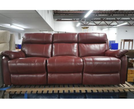 A RED LEATHER ELECTRIC THREE SEATER SOFA, with multiple buttons to recline, adjustable headrest, central armrest with cup hol