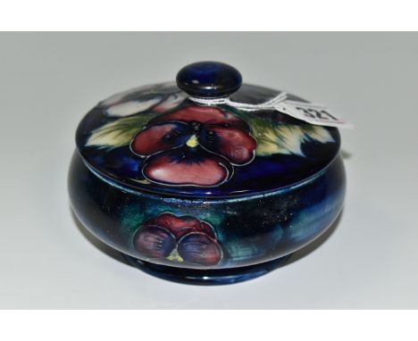 A MOORCROFT POTTERY PANSY DESIGN TRINKET POT, with cover, tube lined with purple and pink flowers on a dark blue ground, impr
