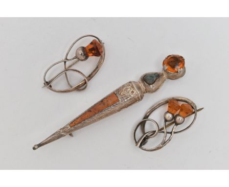 THREE BROOCHES, two white metal open work brooches of thistles set with faceted orange paste, both fitted with brooch pins an