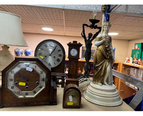 A GROUP OF CLOCKS AND FIGURAL LAMP BASES, comprising a pocket watch and stand, the continental pocket watch stamped 0.800, in