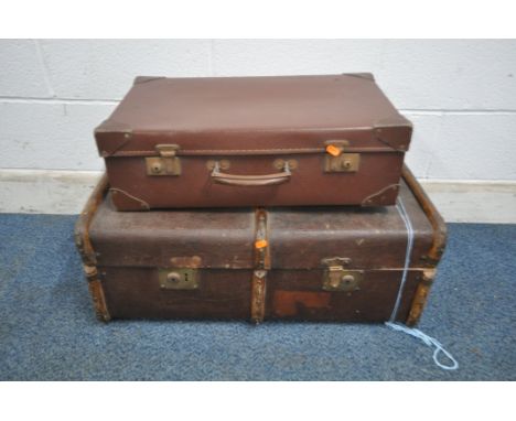 A VINTAGE CANVAS TRAVELING TRUNK, with wooden banding, along with another case (condition report: surface marks, scuffs, dama