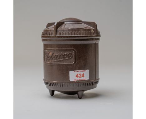 A vintage 1920's phenolic or bakelite tobacco jar with screw top lid and tobacco name badge to front, both body and lid in fi